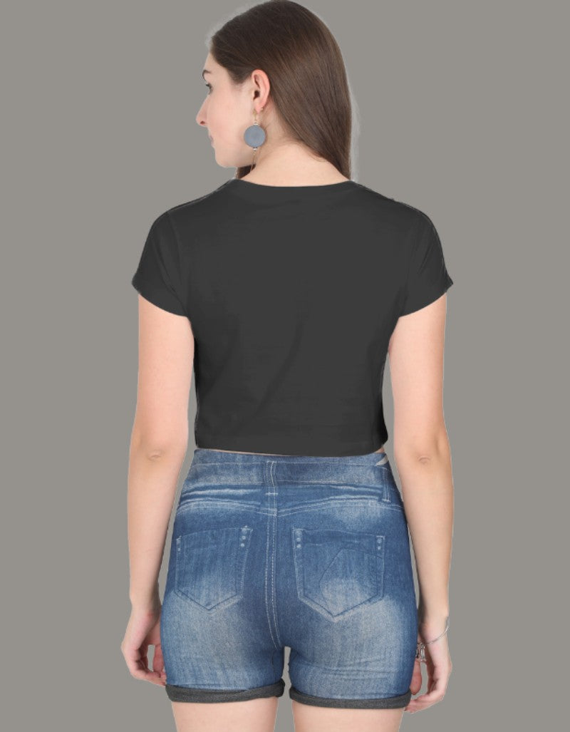 Model wearing a black crop top with rainbow-colored PRIDE text and slogans “Love Loud” and “Love Proud”