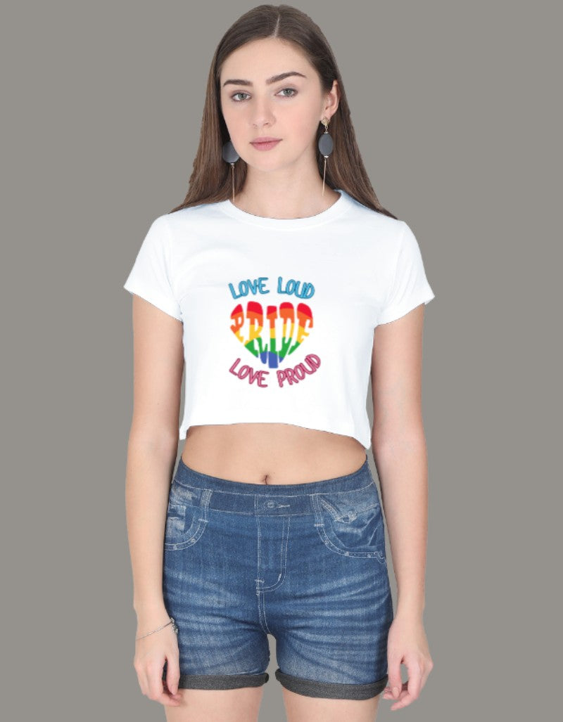 Model wearing a white crop top with rainbow-colored PRIDE text and slogans “Love Loud” and “Love Proud”