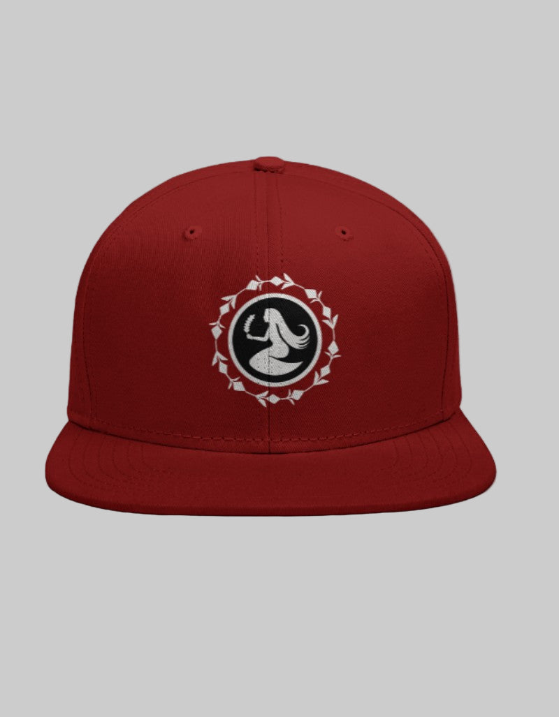 Red snapback cap with Virgo maiden symbol inside a white circular leaf-patterned border.