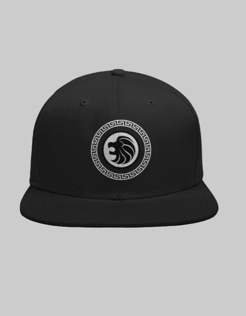 Black snapback cap featuring black lion head design framed by a white Greco-style circular border.