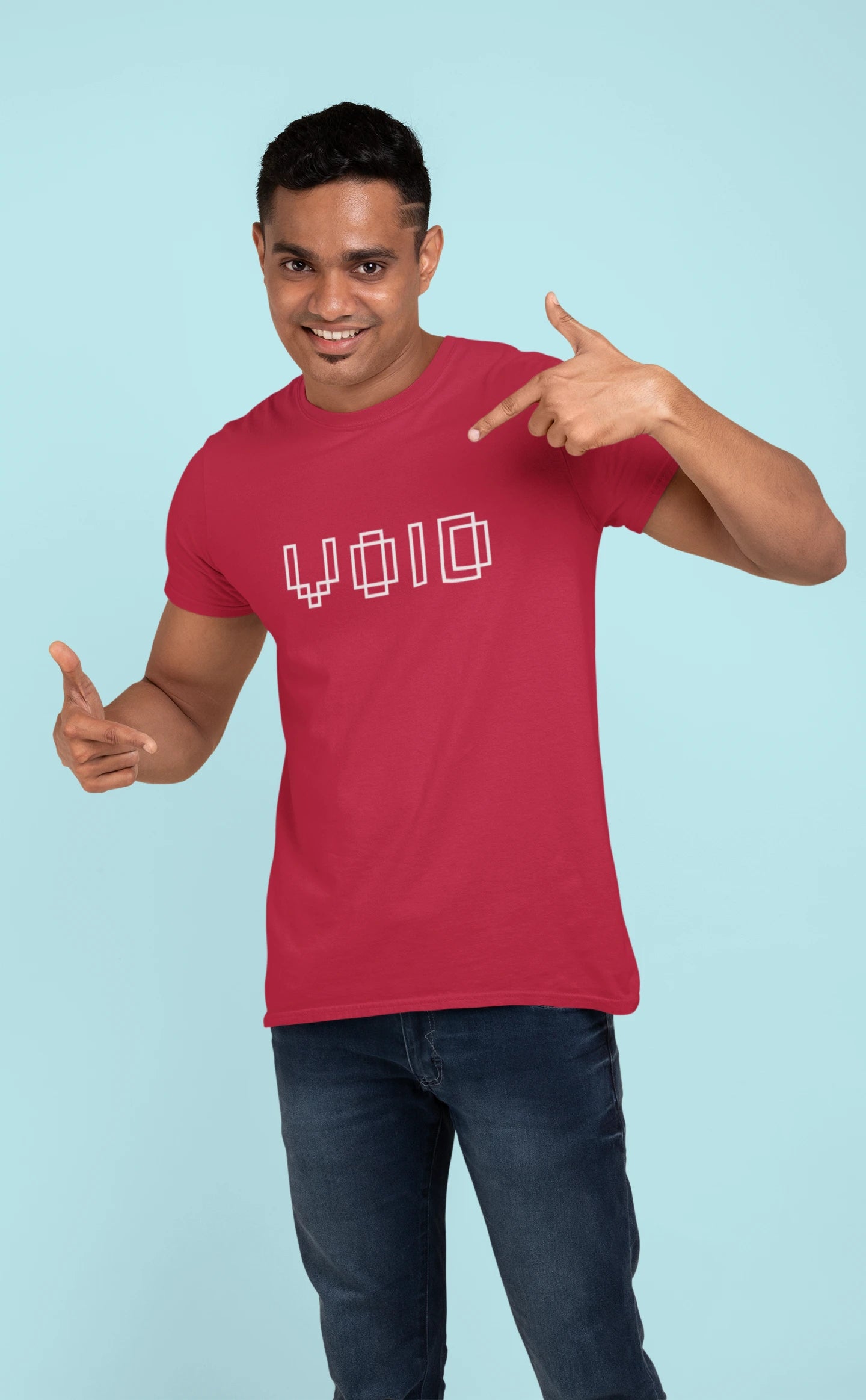 Man wearing a red t-shirt with 'VOID' text, pointing to the shirt against a light blue background