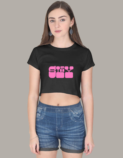 Stylish crop top with bold pink retro font reading "SHY," paired with denim shorts, casual summer outfit for women.