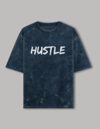  Acid wash oversized t-shirt with bold white "HUSTLE" graphic printed on front, streetwear style