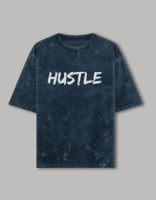  Acid wash oversized t-shirt with bold white "HUSTLE" graphic printed on front, streetwear style